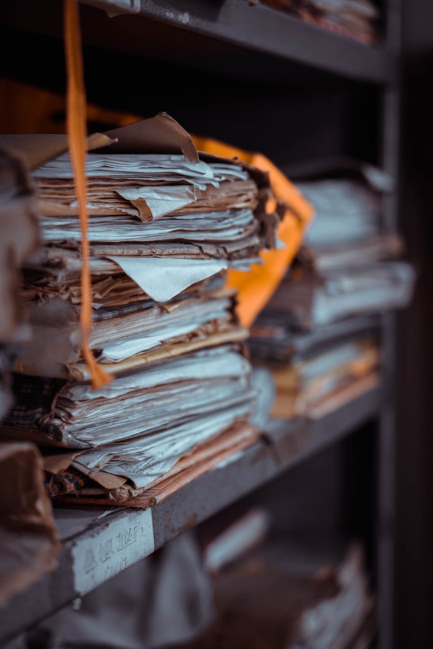 stack of papers on the shelf