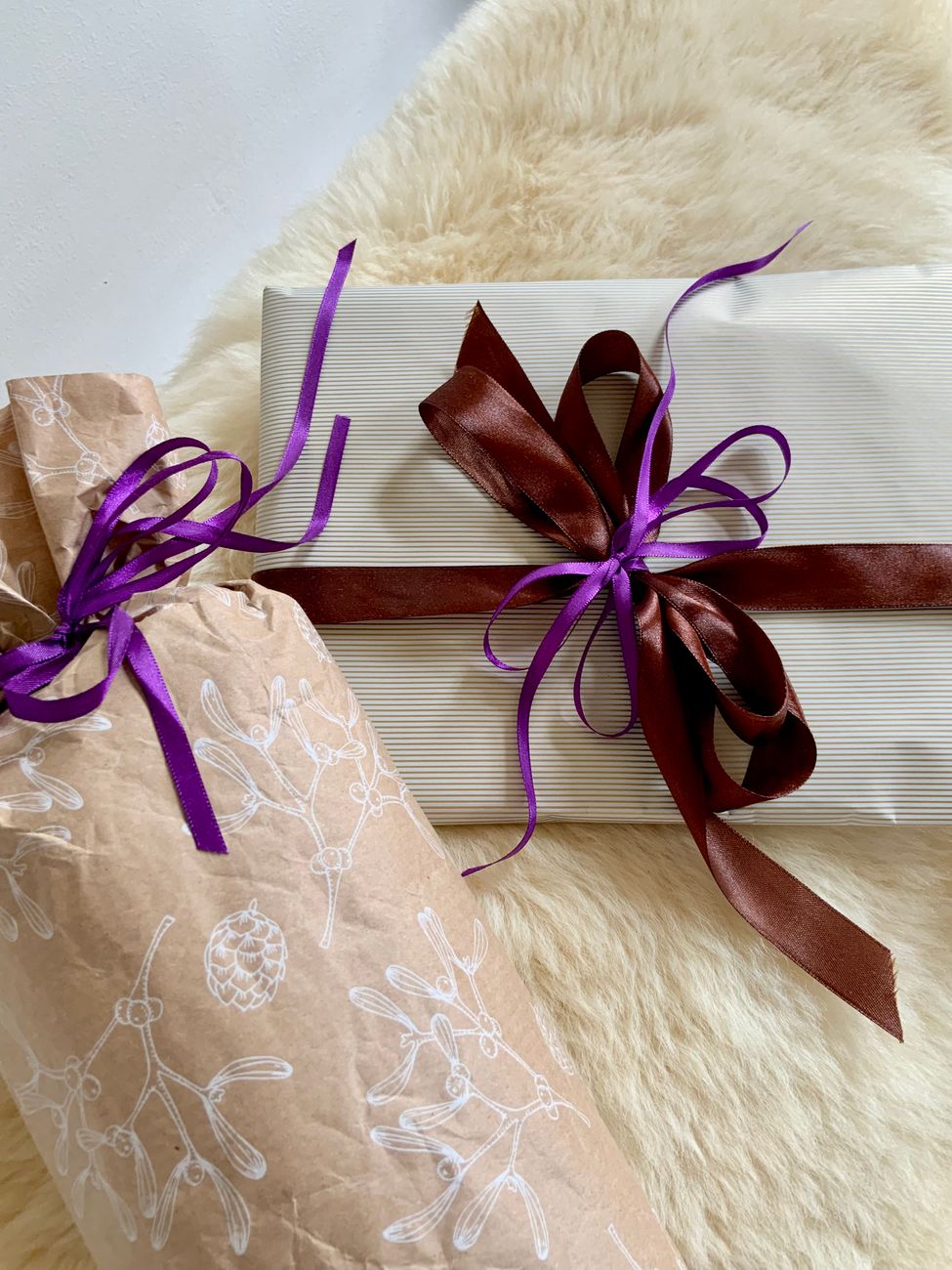 festive wrapped gifts on soft fur background
